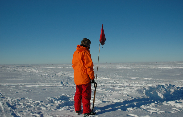 Liz looks at a flag