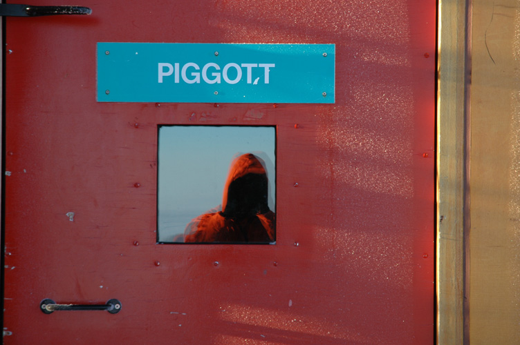 I reflect in the Piggott door