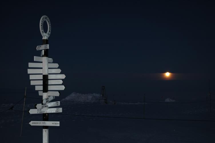 Signpost with moon behind (1 sec w/flash)