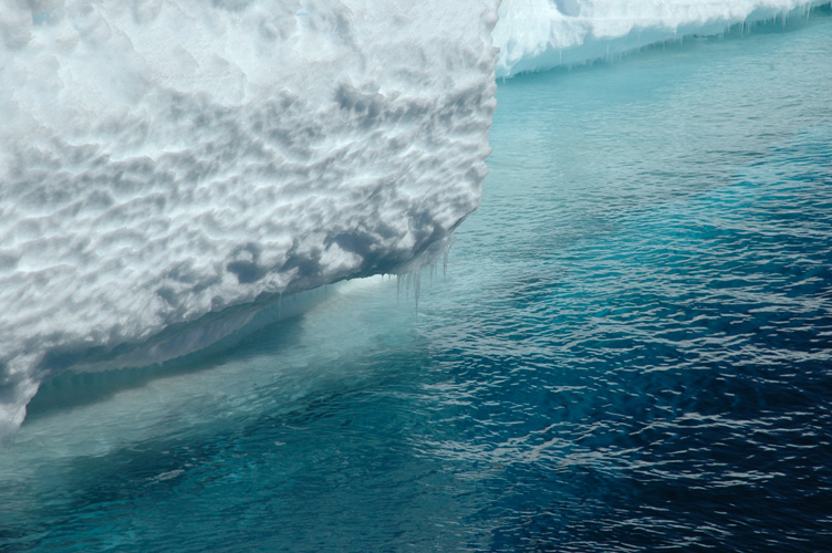 The edge of the ice shelf merges into the sea