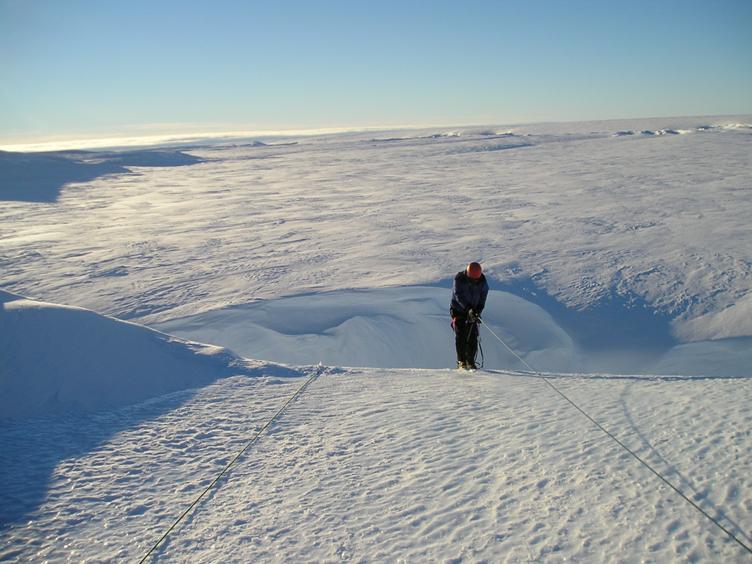 Abseiling off tilted berg