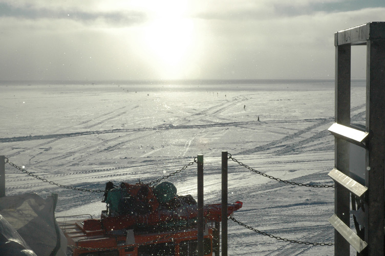 Sno-cat kitted up to travel, with sun pillar 