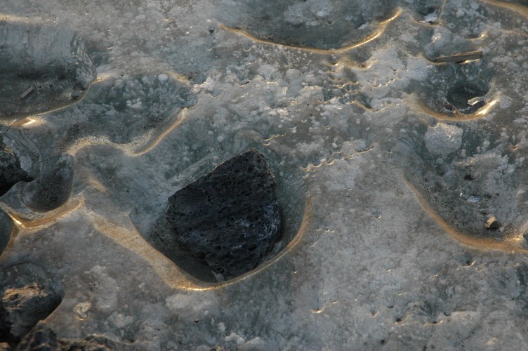 Pools and puddles form and rocks act as hotspots melting themselves seats