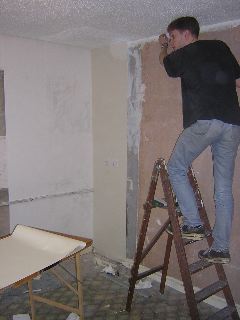 Pete papering the kitchen