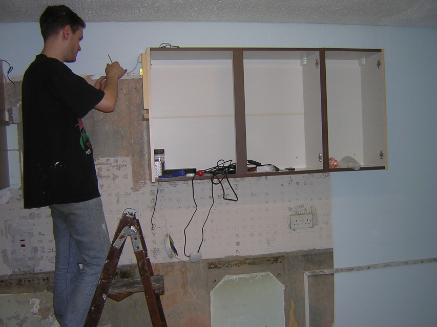 Pete playing with electrics in the kitchen