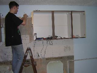 Pete playing with electrics in the kitchen